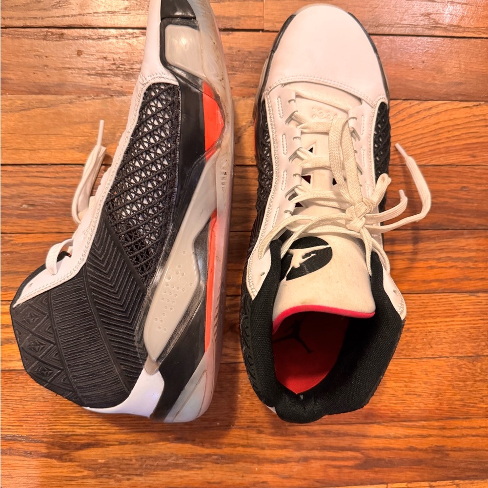 Jordan’s Black and White High-Top Sneakers with Red Accents